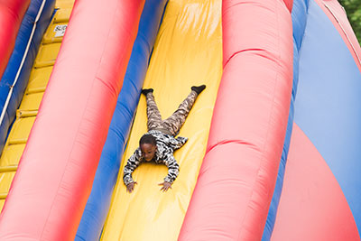 Kid going down inflatable slide